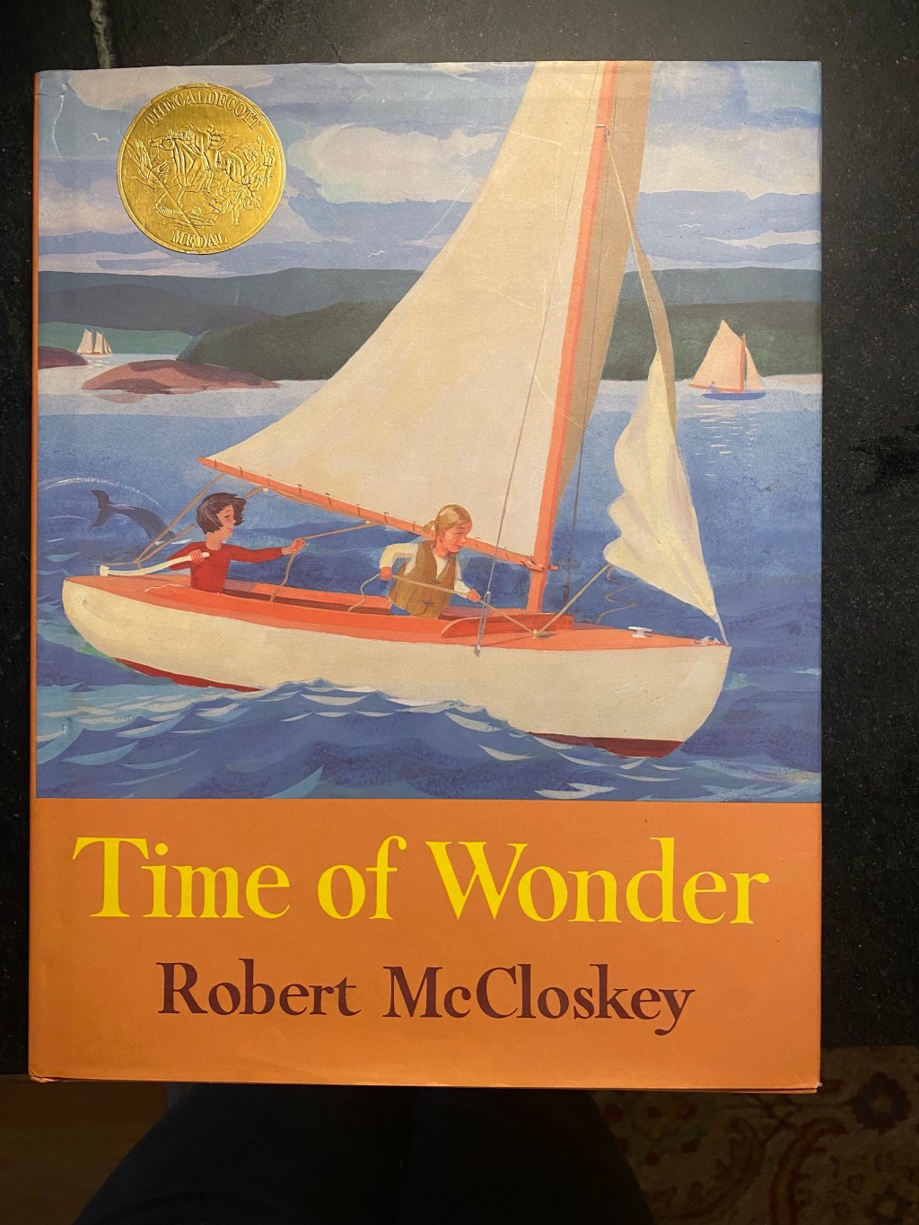 Time of Wonder, by Robert McCloskey. Written in 1957.